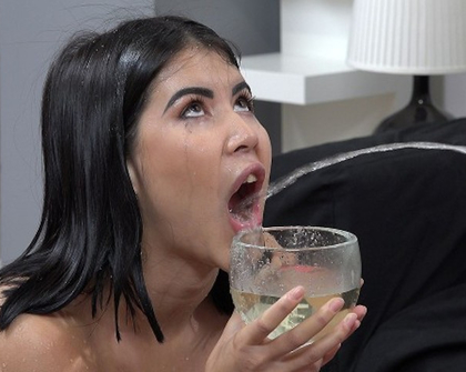 Submissive slut drinking piss through
