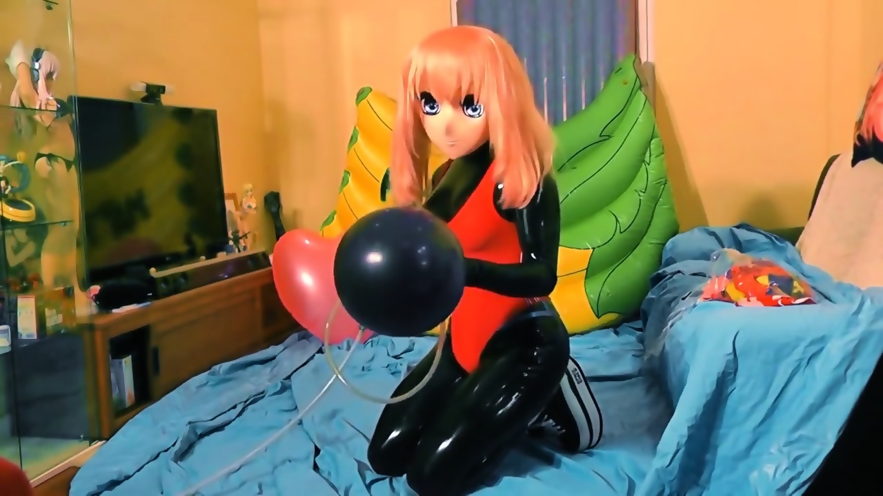 Rubber kigurumi girl playing dick