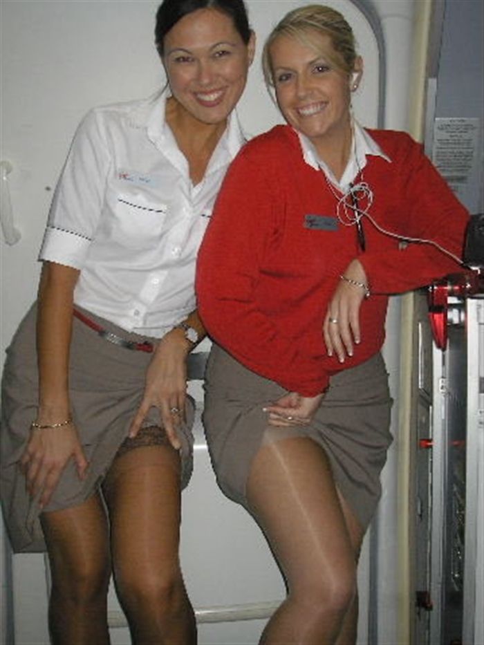 Flight stewardess with pantyhose airport